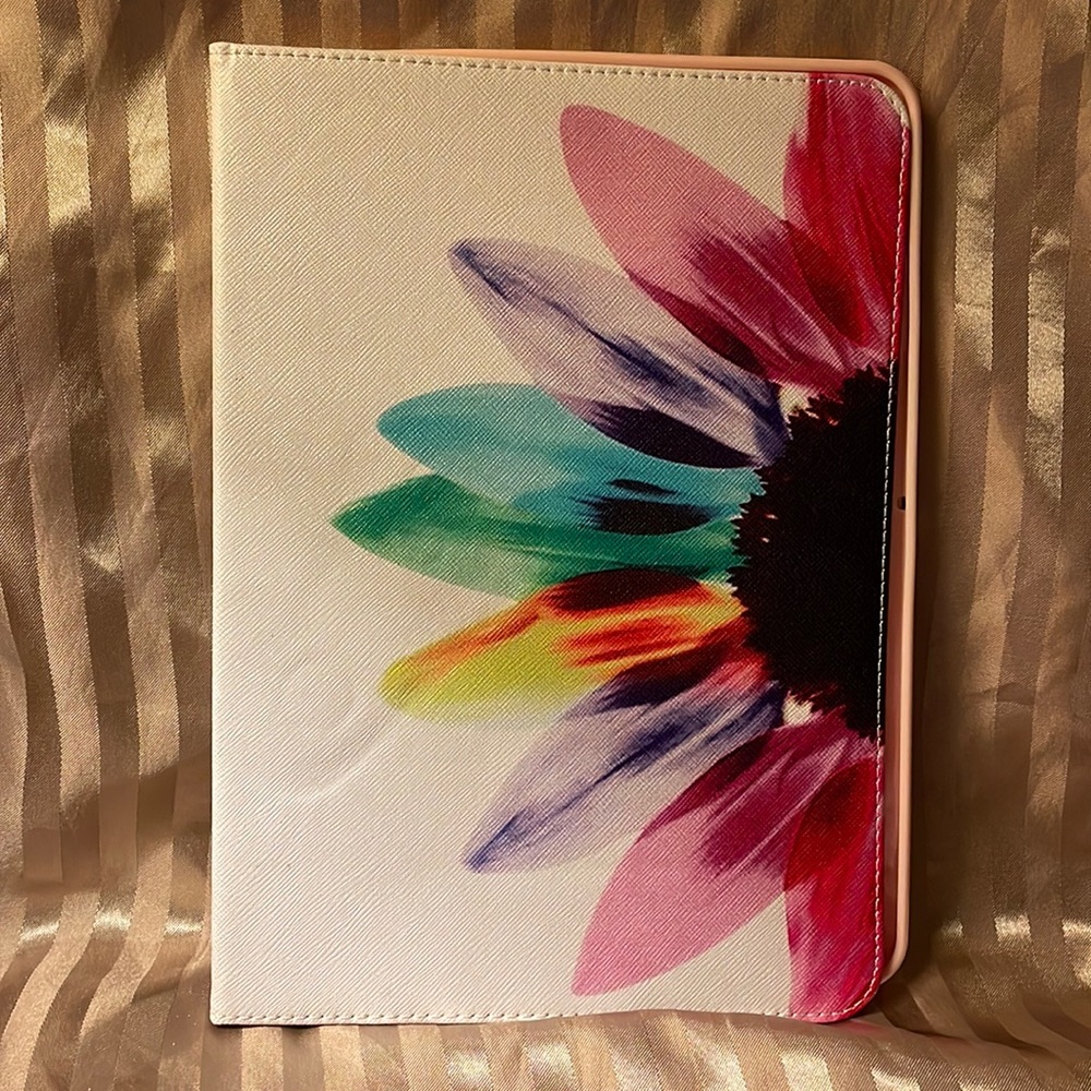 Floral pink colored tablet cover- not sure what type tablet fits in it.